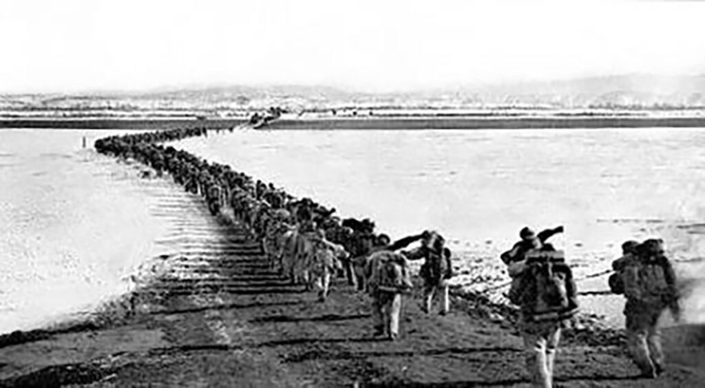 Korean War - Chinese forces cross the frozen Yalu River. North Korea Focus.